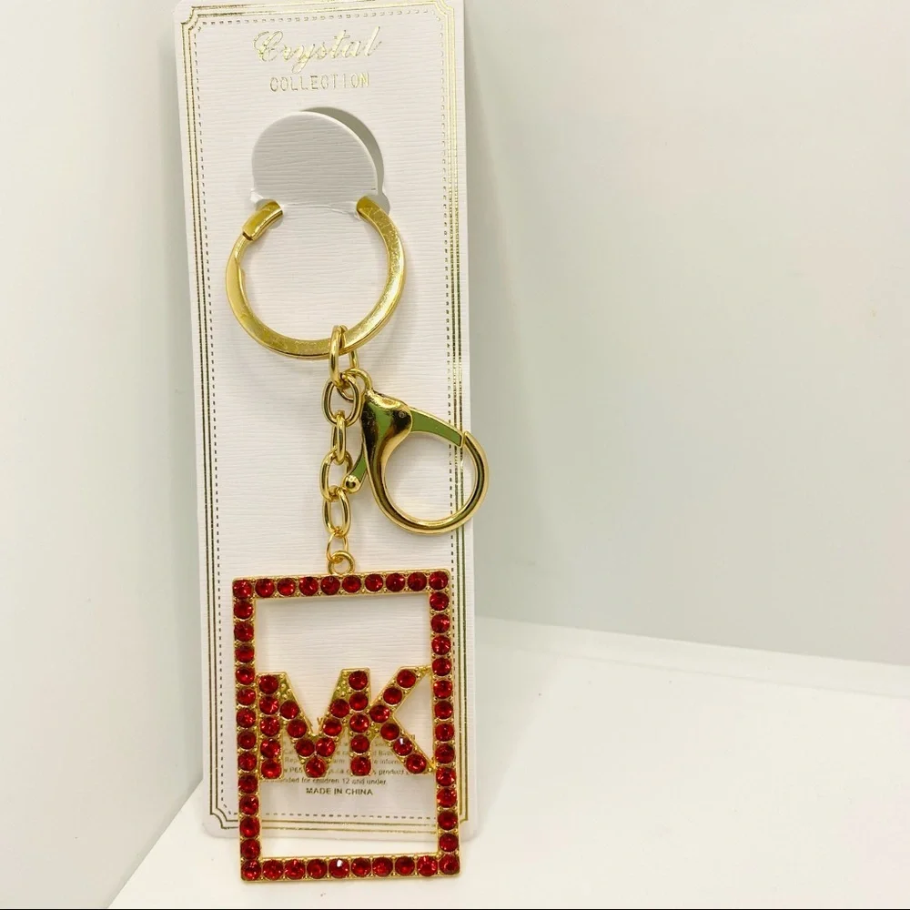 Purse Charm Key Chain MK in Red Crystals set in golden tone.